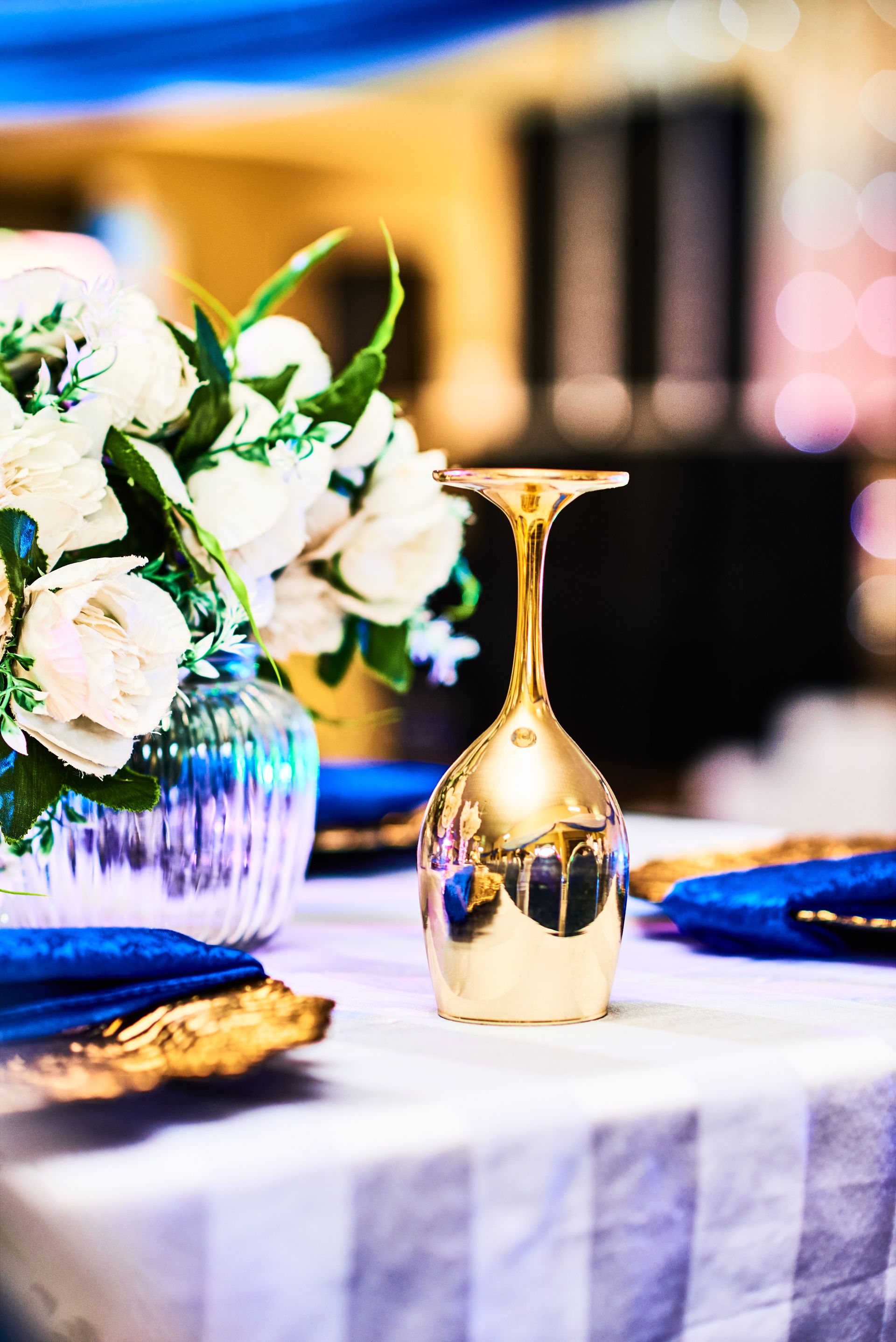 Elegant wedding table setting with gold goblet
