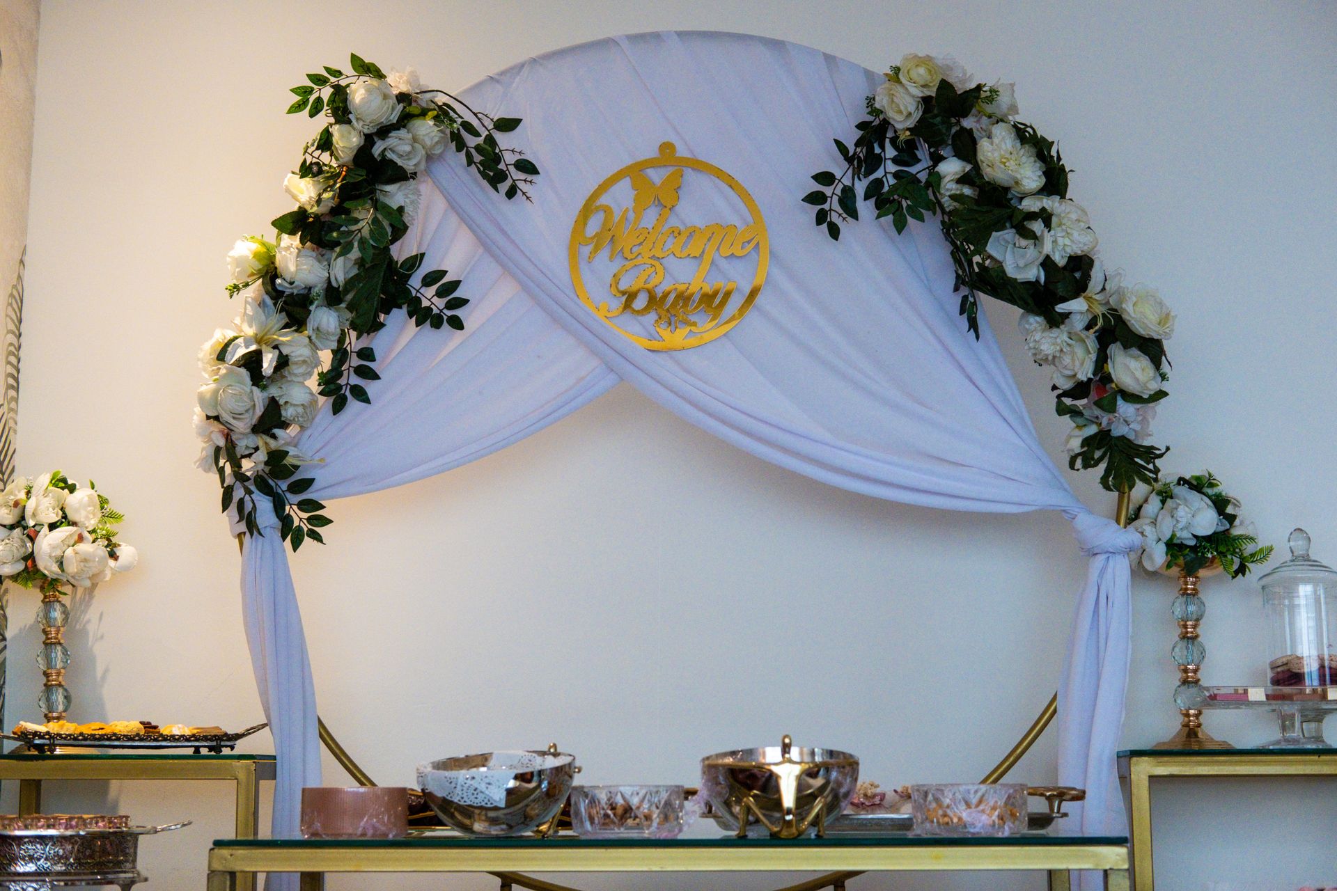 Elegant baby shower decoration with floral arch