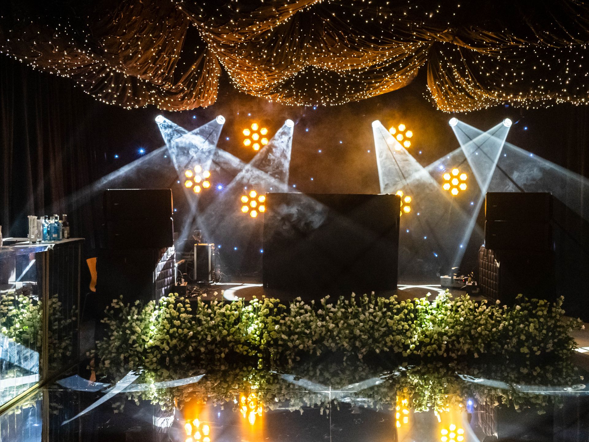 Dazzling event stage with lights and flowers