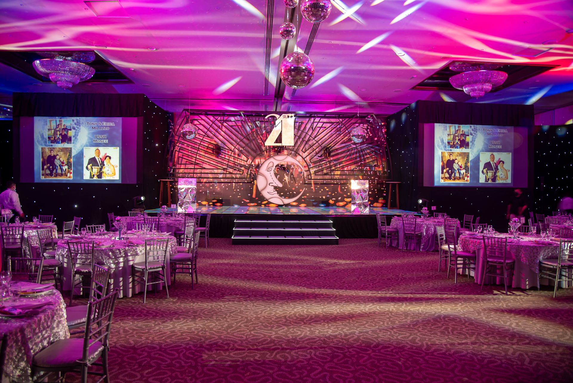 Elegant themed event hall setup with stage